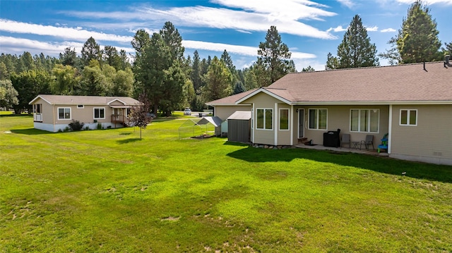 125 Ponderosa Ln, Kalispell, MT 59901 - view of grassy yard featuring a patio