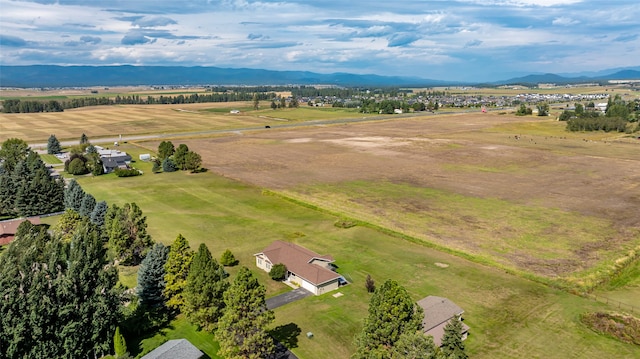 drone / aerial view featuring a mountain view and a rural view