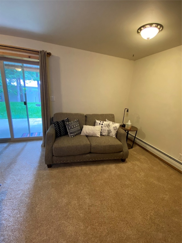 carpeted living room featuring a baseboard heating unit