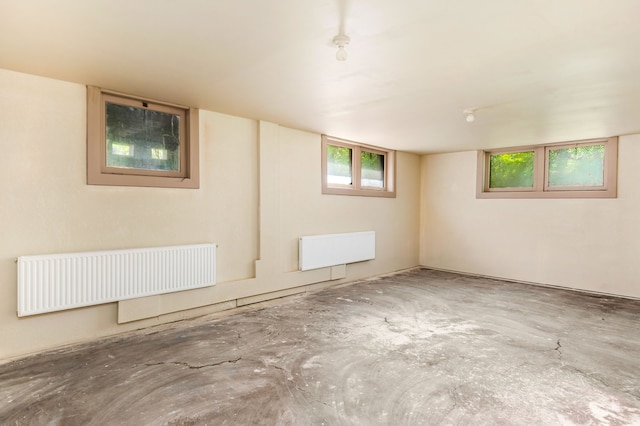 basement featuring radiator heating unit