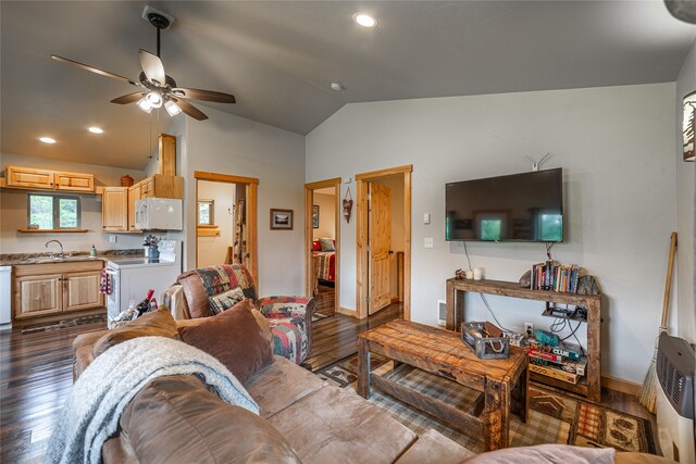 living room featuring vaulted ceiling, sink, ceiling fan, and dark wood-type flooring