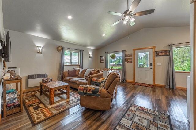 living room with lofted ceiling, plenty of natural light, ceiling fan, and dark hardwood / wood-style floors