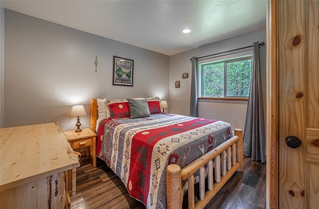 bedroom featuring dark hardwood / wood-style flooring