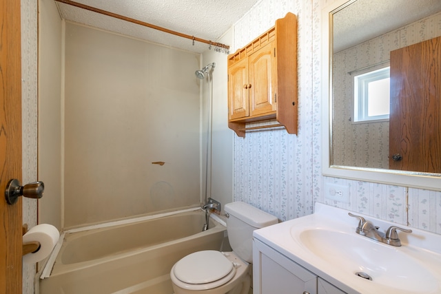 full bathroom featuring vanity, a textured ceiling, toilet, and shower / bathtub combination