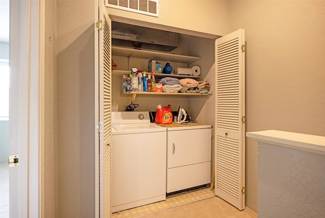 laundry area featuring independent washer and dryer