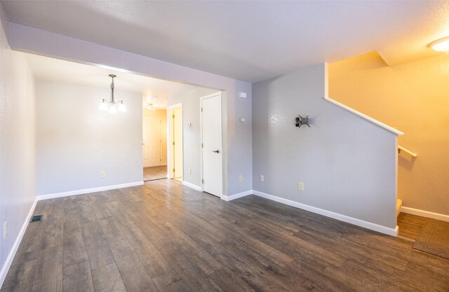 living room with hardwood / wood-style floors and a notable chandelier