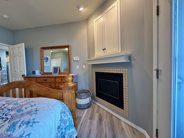 100 Rocky Point Rd Unit B-2, Polson, MT 59860 - bedroom with wood finished floors and a fireplace