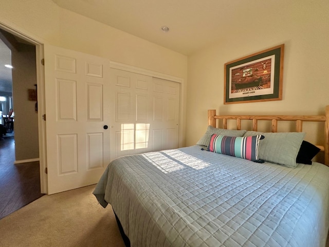 carpeted bedroom with a closet