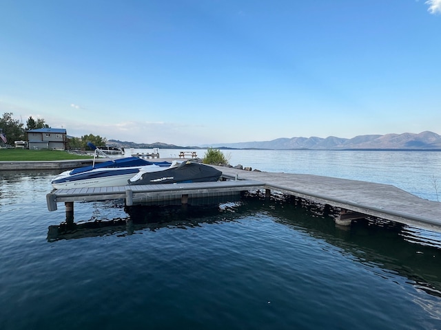 dock area with a water and mountain view