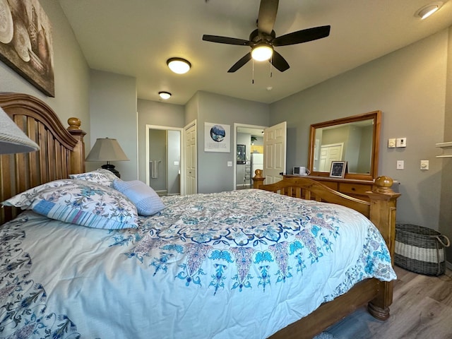 bedroom featuring light wood-type flooring and ceiling fan