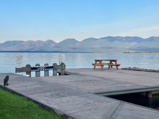 100 Rocky Point Rd Unit B-2, Polson, MT 59860 - view of dock featuring a water and mountain view