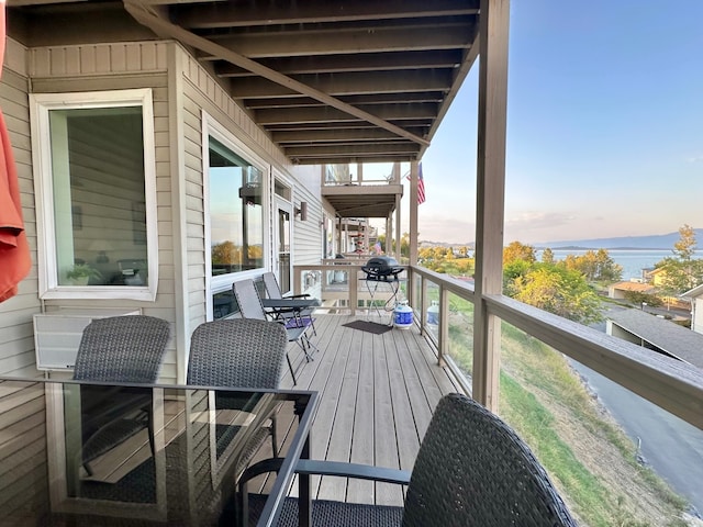 wooden deck with a water view