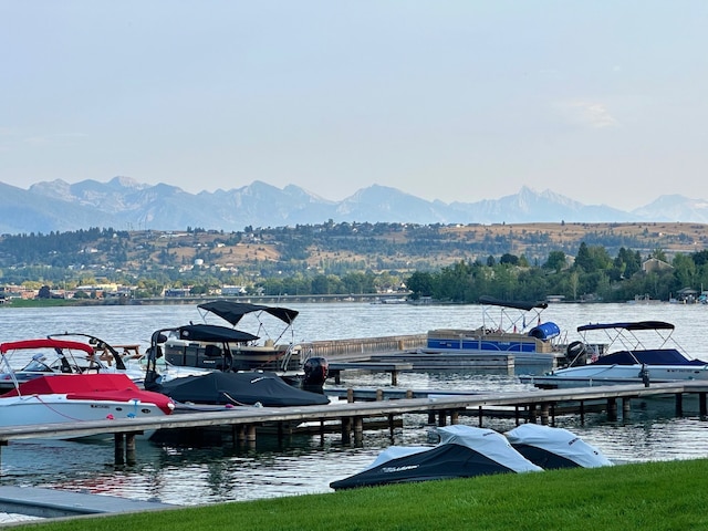 dock area with a water and mountain view