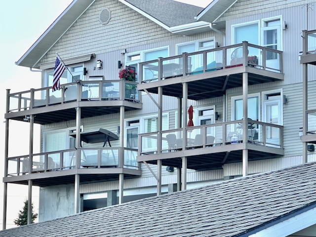 rear view of house featuring a balcony