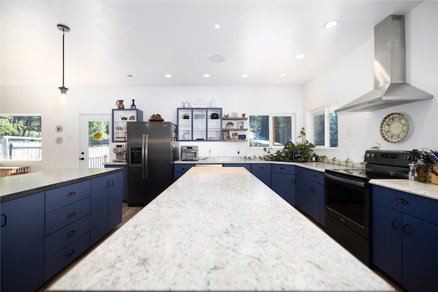 965 Ksanka Foothills Rd, Eureka, MT 59917 - kitchen with a center island, blue cabinets, refrigerator with ice dispenser, black / electric stove, and ventilation hood