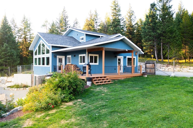 965 Ksanka Foothills Rd, Eureka, MT 59917 - view of front of home with roof with shingles, fence, and a front lawn
