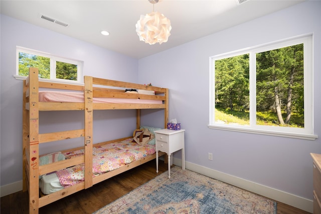 965 Ksanka Foothills Rd, Eureka, MT 59917 - bedroom featuring a chandelier, wood finished floors, baseboards, visible vents, and recessed lighting