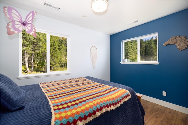 965 Ksanka Foothills Rd, Eureka, MT 59917 - bedroom featuring baseboards, visible vents, and wood finished floors