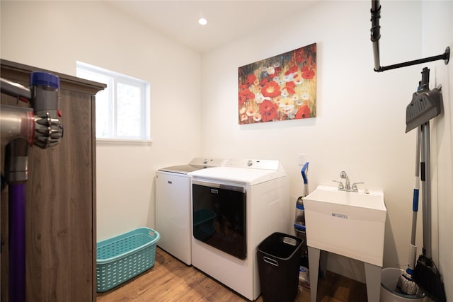 965 Ksanka Foothills Rd, Eureka, MT 59917 - washroom featuring a sink, light wood finished floors, separate washer and dryer, laundry area, and recessed lighting
