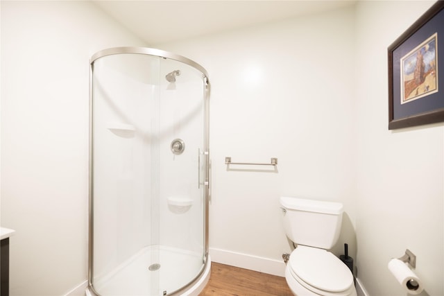 965 Ksanka Foothills Rd, Eureka, MT 59917 - full bath with vanity, a stall shower, baseboards, and wood finished floors