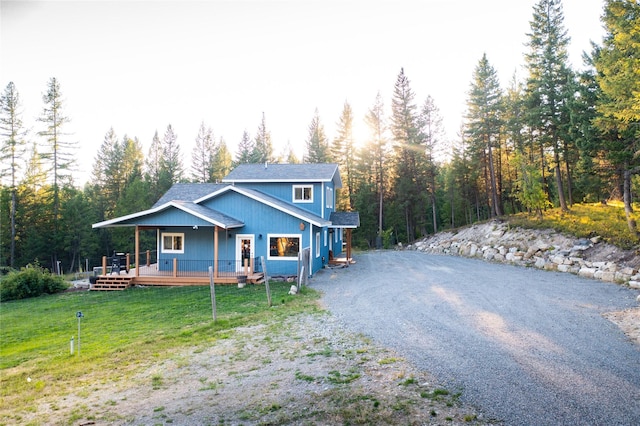 965 Ksanka Foothills Rd, Eureka, MT 59917 - view of front of house featuring driveway, a front yard, and a wooded view