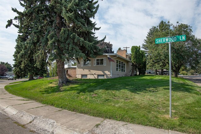 105 Sherwood Ln, Kalispell, MT 59901 - view of side of property with a lawn