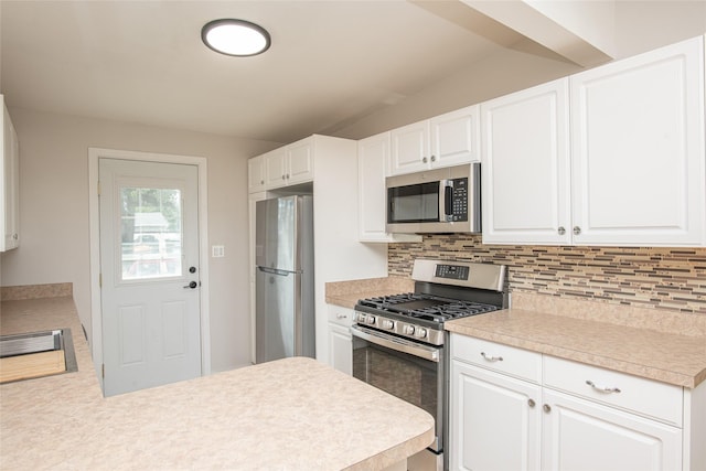 kitchen with light countertops, white cabinets, tasteful backsplash, and stainless steel appliances