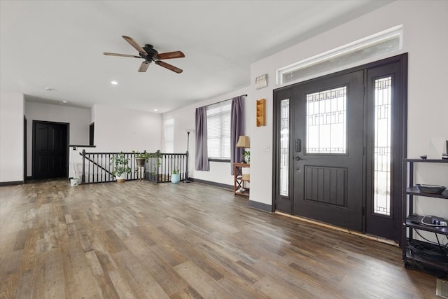 entryway with ceiling fan and hardwood / wood-style flooring