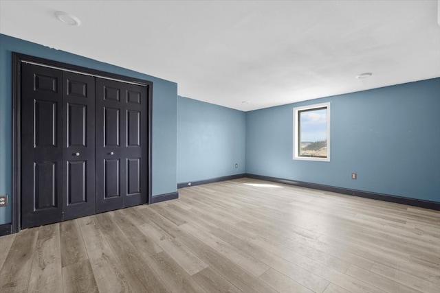 interior space with light hardwood / wood-style flooring and a closet