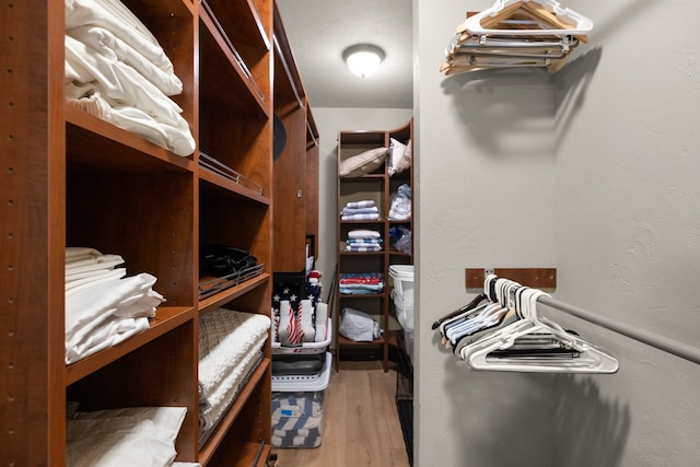 walk in closet featuring hardwood / wood-style floors