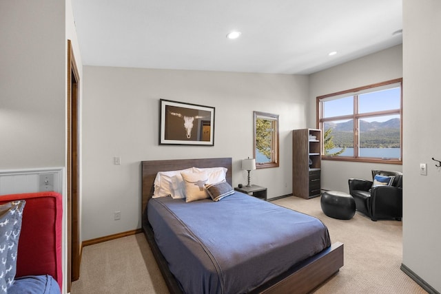1320 W Lakeshore Dr, Whitefish, MT 59937 - carpeted bedroom with recessed lighting, a mountain view, and lofted ceiling