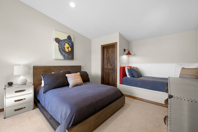 carpeted bedroom featuring vaulted ceiling