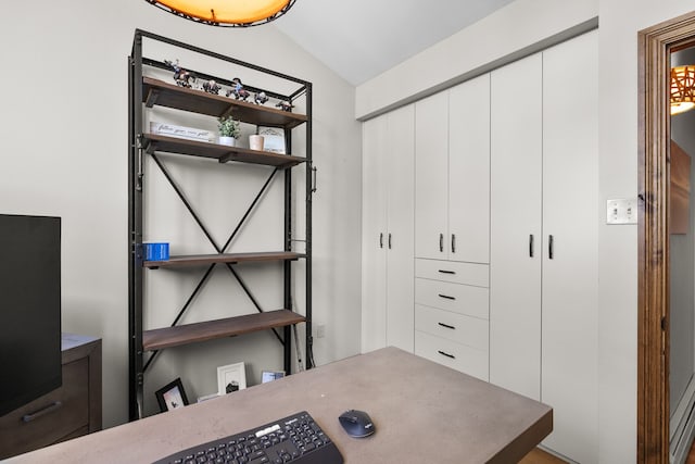 office area featuring lofted ceiling