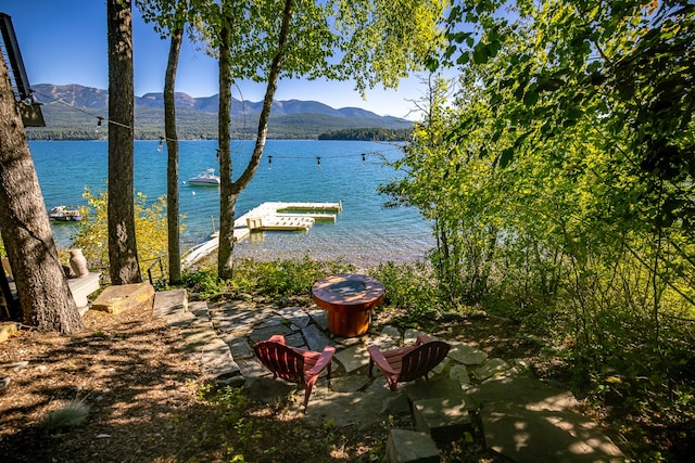 view of water feature featuring a mountain view and a boat dock