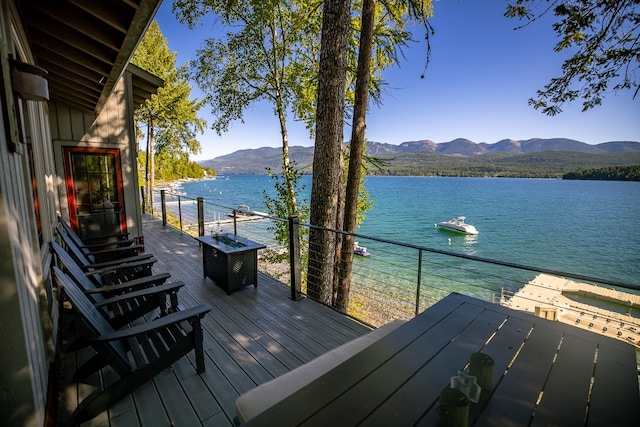 deck featuring a water and mountain view