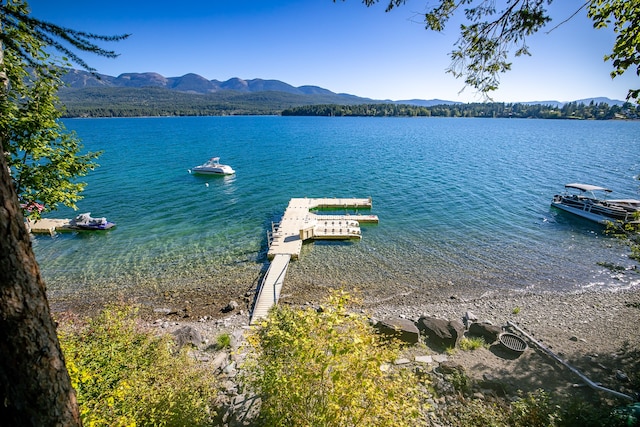 view of water feature featuring a mountain view and a boat dock