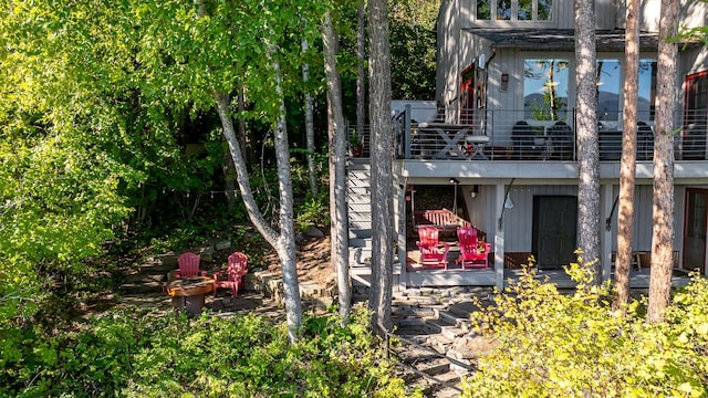 1320 W Lakeshore Dr, Whitefish, MT 59937 - rear view of house featuring a fire pit and a deck