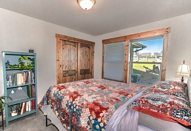 carpeted bedroom featuring access to outside