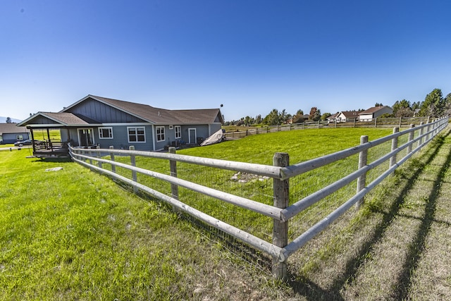 view of yard with a rural view