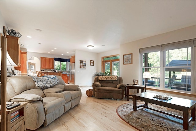 living room featuring light wood-type flooring and recessed lighting