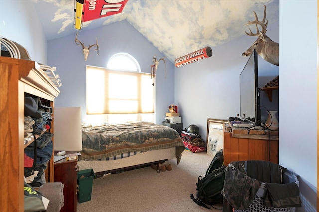 bedroom featuring vaulted ceiling and carpet flooring