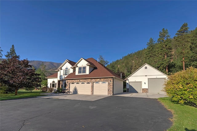 view of front of house featuring stone siding and a mountain view