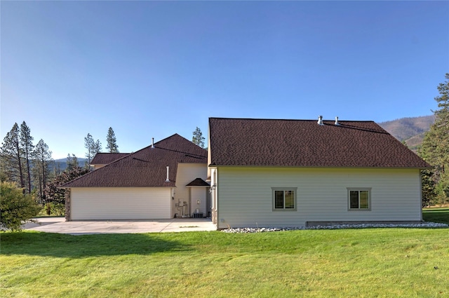 exterior space with a patio area and a yard