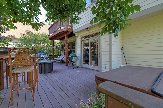 wooden terrace featuring grilling area