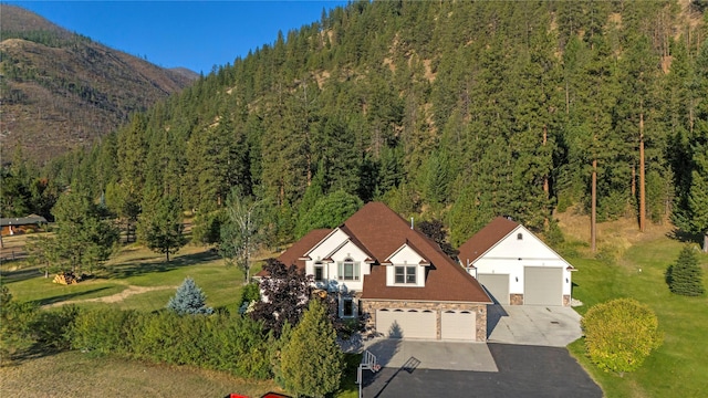 drone / aerial view featuring a view of trees