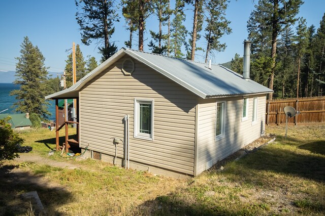 view of side of property with a yard