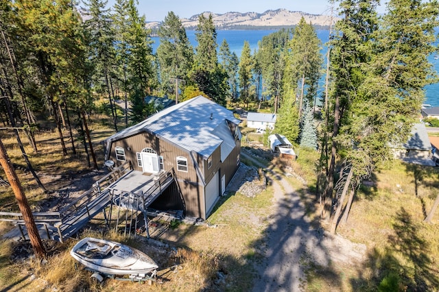 drone / aerial view with a water and mountain view