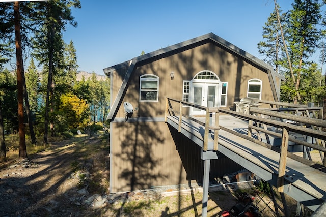 exterior space with a wooden deck and french doors