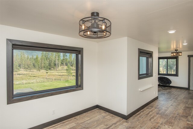 unfurnished dining area featuring hardwood / wood-style floors