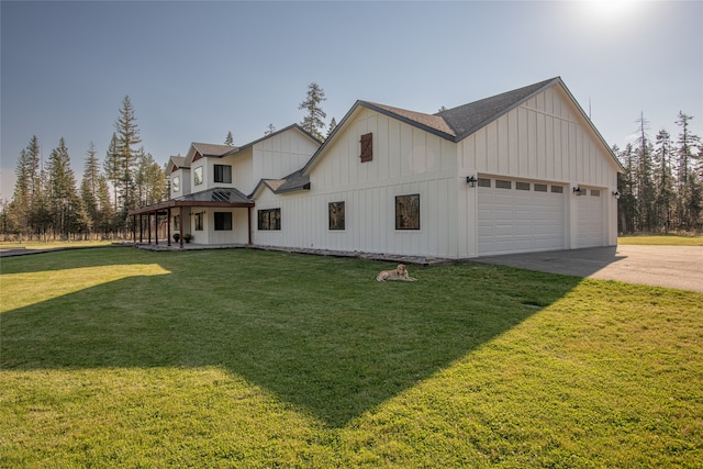 view of front facade with covered porch, a garage, and a front lawn